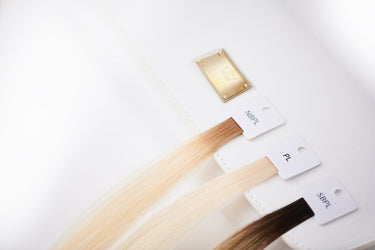 Color ring fanned out for choosing tape-in and clip-in extension shades – Rubin Extensions®