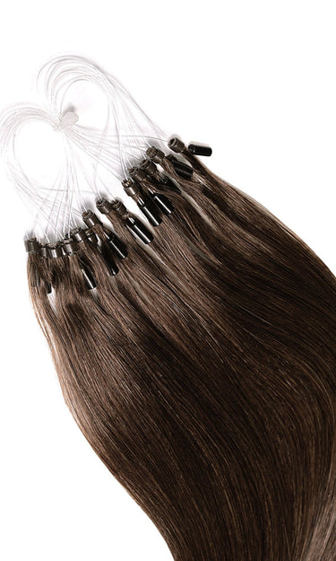 Detail of glossy Remy human hair strands, Pro-Deluxe microrings in Chocolate Dark Brown – Rubin Extensions®
