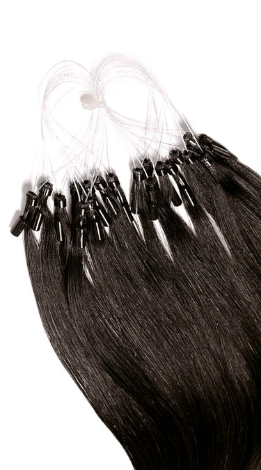 Close-up of individual Black-Brown microring strands, glossy Remy human hair – Rubin Extensions®