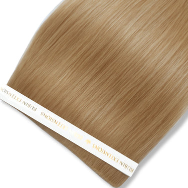 Close-up of caramel-toned human hair strands, Light Brown Caramel Genius Weft – Rubin Extensions®